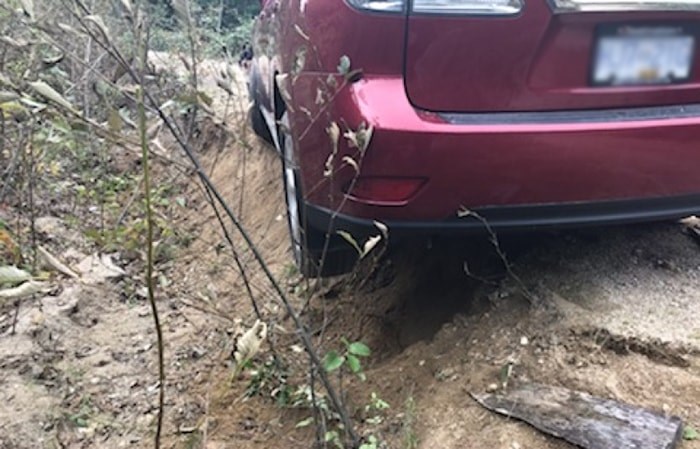  The SUV stuck on the side of a logging road near Menacher Road in Pender Harbour.