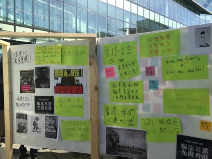  Supporters have placed various sticky notes on the Lennon Wall. Photo by Nono Shen