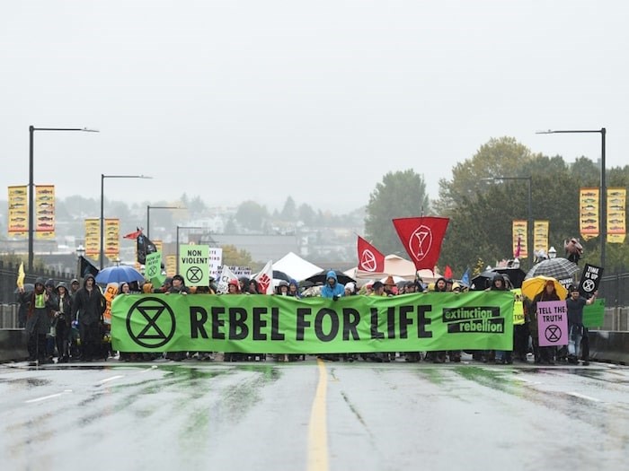  The protest group Extinction Rebellion closed the Burrard Bridge Monday, Oct. 7. They are holding a route-less 'snake march' through downtown Vancouver on Fri. Oct. 18. Photo Dan Toulgoet/Vancouver Courier