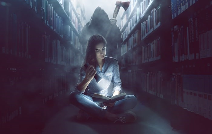  To get you into the mood for things that lurk in the dark, VPL’s reading experts have rounded up this list of top picks for all monster fans. Photo: Reading scary book in library/Shutterstock