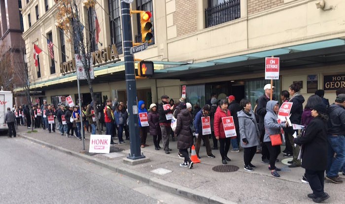  Workers strike outside the Rosewood Hotel Georgia in Vancouver. 