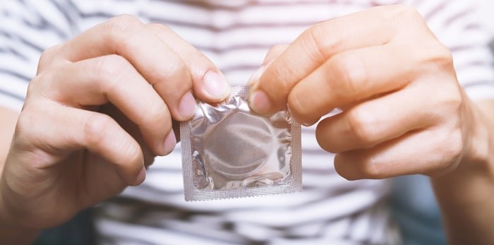  Health care professionals are issuing reminders that condoms help prevent the spread of STIs. Photo: Condom/Shutterstock