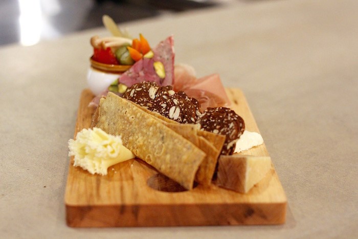  The Happy Hour butcher board features house-made charcuterie and crackers, cheese, and an assortment of pickled veg. Photo by Lindsay William-Ross/Vancouver Is Awesome