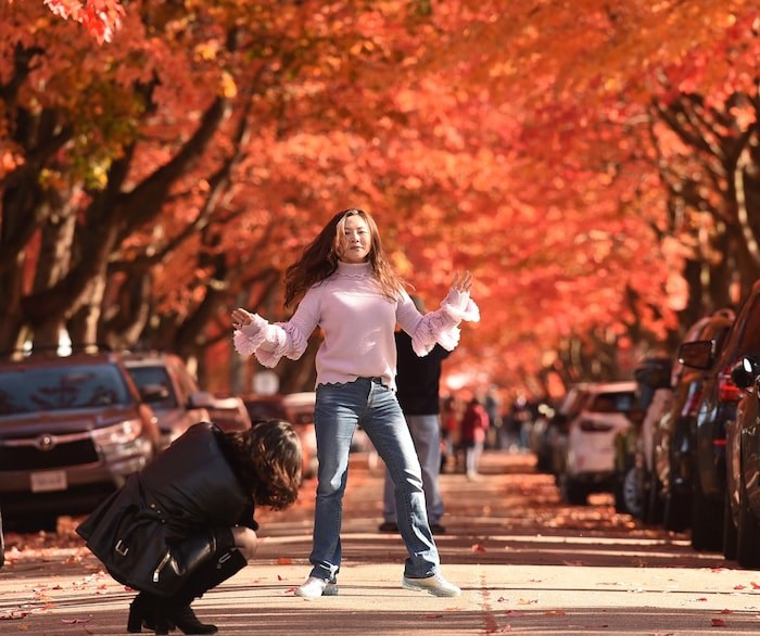  STRIKE A POSE: The vibrant fall colours along Cambridge Street in the East Vancouver neighbourhood of Hastings-Sunrise attract a steady crowd in search of the perfect photo. Photo Dan Toulgoet