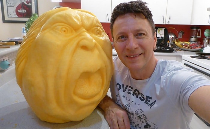  Clive Cooper with one of his pumpkin carvings. Photo: Sparksfly design