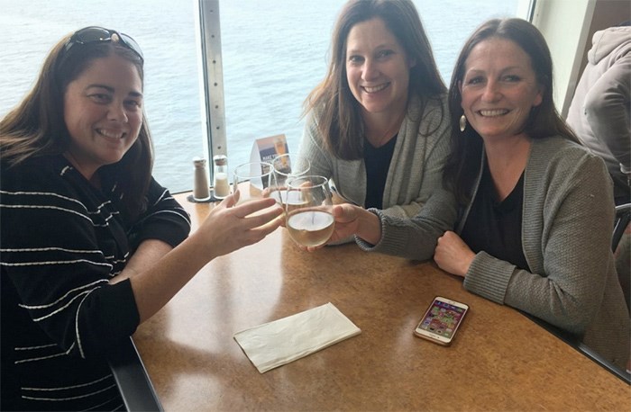  From left: Lisa McKim, Nadia Cauvin, Mara Humphries enjoy a glass of wine on the Coastal Celebration returning to Victoria from a morning shopping trip in Vancouver.