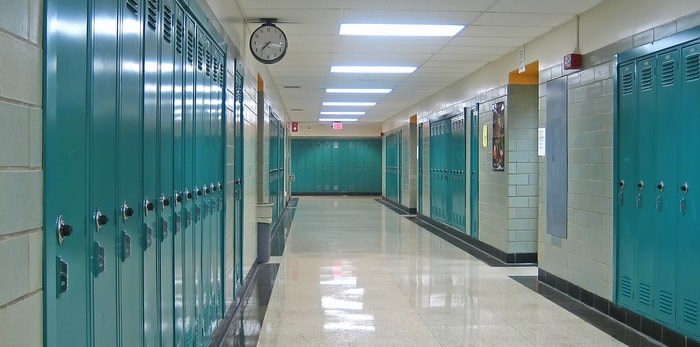  A teacher on call in Campbell River, B.C. has been suspended after he made several disturbing remarks to his Grade 8 students. Photo: Lockers in a school hallway/Shutterstock