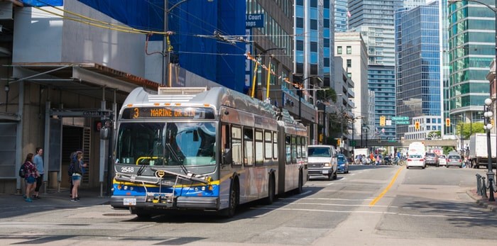  TransLink reports that they have reduced frequency on 25 bus routes across the region Friday morning. Photo: A TransLink bus in downtown Vancouver. Marc Bruxelle / Shutterstock.com