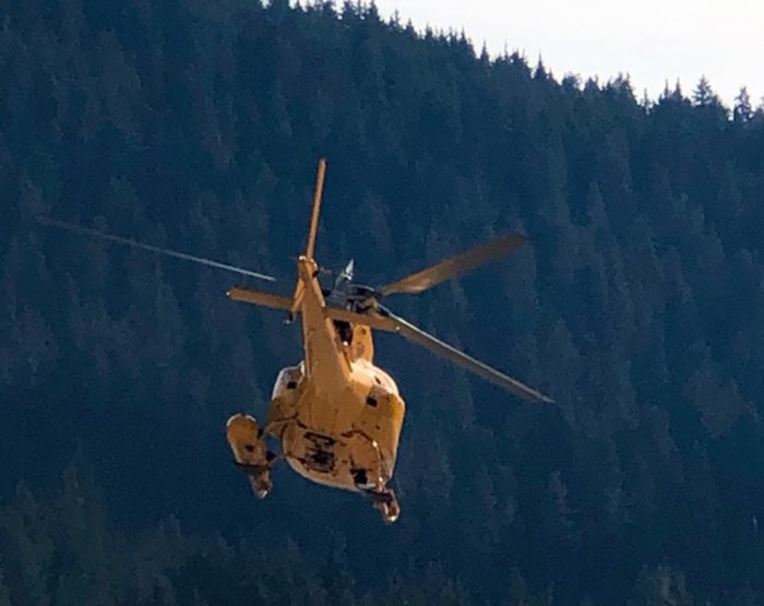  A Talon helicopter comes in to land at the Cypress SAR command centre in West Vancouver Thursday morning. Searchers from Lions Bay and the North Shore have been combing the backcountry with the help of Talon helicopters after a 25-year-old hiker went missing from the Howe Sound Crest Trail Wednesday afternoon. Photo Mike Wakefield, North Shore News.