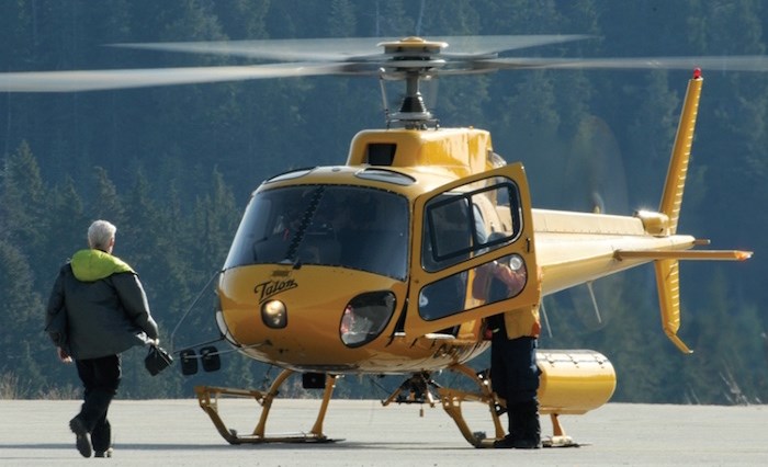  A Talon helcopter lands at North Shore Rescue's search base on Cypress Mountain Thursday morning. Searchers from Lions Bay and the North Shore spent Wednesday night combing the backcountry after a 25-year-old hiker went missing from the Howe Sound Crest Trail Wednesday afternoon. He was found alive and well Thursday. photo Mike Wakefield, North Shore News.