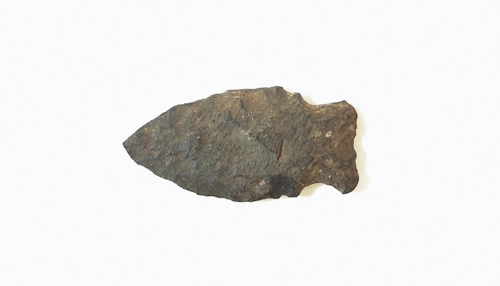  This stone projectile point was unearthed in 1894 from a midden located where the Burnaby Village Museum is today. - Burnaby Village Museum