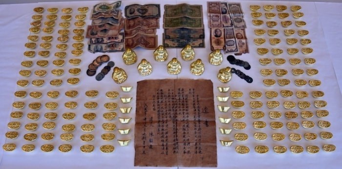  A Chinese gold scam that first appeared in Richmond in 2010 could be returning to the city, according to Richmond RCMP. Common items used in the scam include fake gold Buddha figurines and gold ingots, as well as handwritten wills or letters. Photo courtesy Richmond RCMP