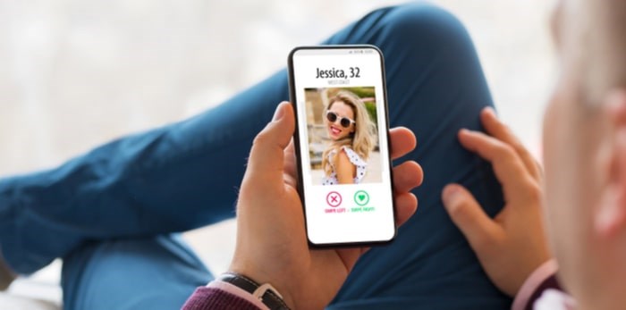  Police in Delta had to intervene when an intoxicated man looking for his Tinder date tried to scale a building. Photo: Man looking at Tinder/Shutterstock