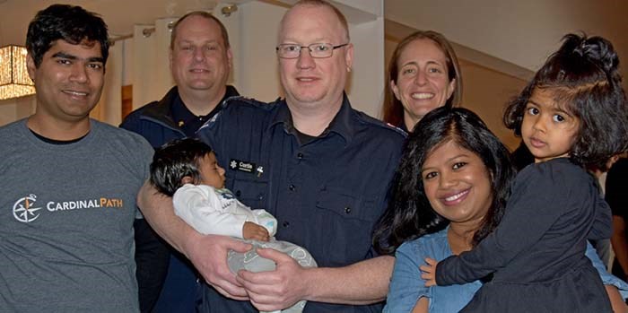  Baby Arthur, held by paramedic Curtis Rasmussen, with (left to right) father Anish John, paramedics Jason Davies and Sami Lingren, and mother Jasmine Anish John with daughter Viola Scarlette John, 3. Missing is paramedic Michella McCaskill.