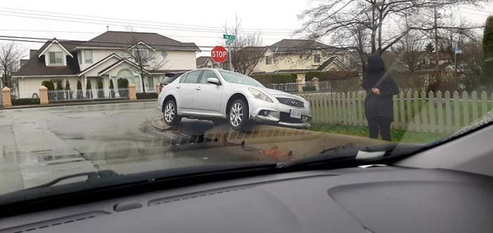  A silver car somehow came to a stop on a concrete barrier at the corner of No. 4 and Alexandra roads.