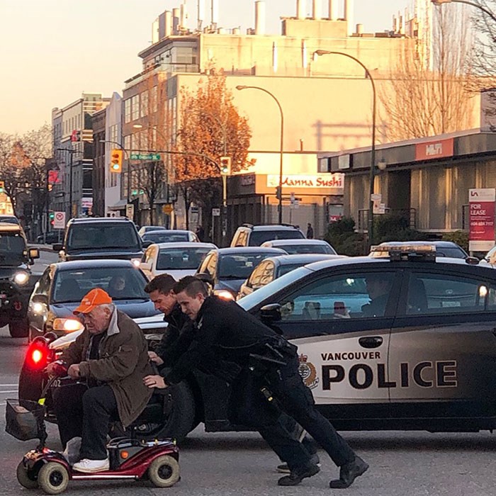  The VPD rescue a man on a broken down mobility scooter in the middle of 2nd Avenue in Vancouver. Photo Richard Schell.