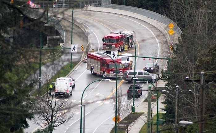  Emergency crews attend the site of a fatal crash on Cariboo Road in January that saw a 15-year-old girl killed on a controversial crosswalk. Burnaby NOW file photo