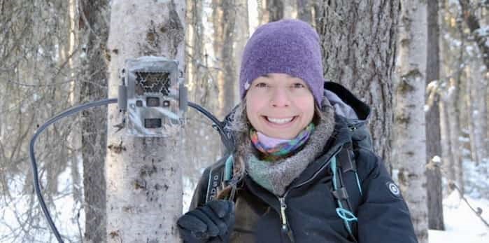  Sandra Frey, a UVic Masters student, uses a camera trap to capture pictures of animals when they trigger a motion sensor. Photo: Sandra Frey