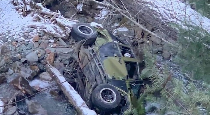  A vehicle that was carrying seven people lies on its side in a river bed after rolling down a steep embankment early Friday. Nov. 29, 2019. Photo: CHEK News