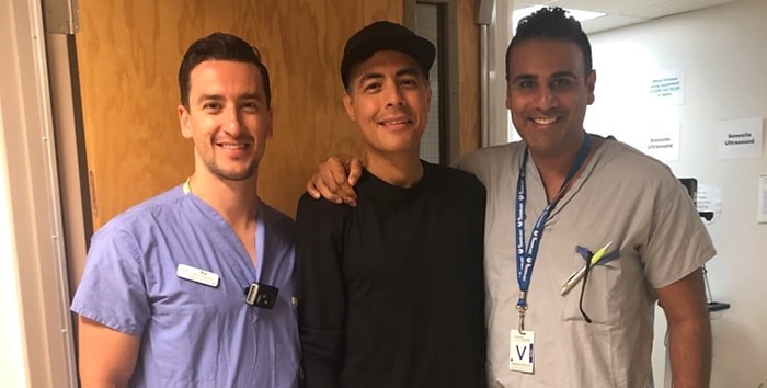  Nick Kanaan (centre) is flanked by Vancouver General Hospital physiotherapist Rys Chapple (left) and Dr. Hussein Kanji. Photo courtesy Vancouver Coastal Health