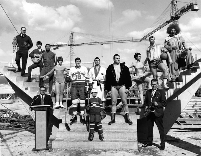  Athletes and performers representing future uses of the Pacific Coliseum standing in the construction site in 1967. Harry Jerome (third from left), Karen Magnussen (fourth from left), Barry Watson (fifth from left, in Canucks jersey) and Gene Kiniski (fourth from right).