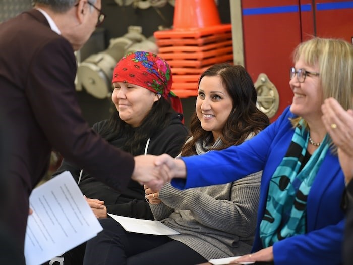  Andrea (in the centre) moved into Pacific Spirit Terraces late last week. Here, she's shown at the opening ceremony. Photo Dan Toulgoet