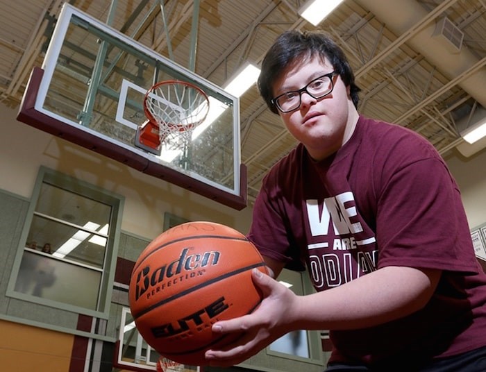  Grade 12 student Reid Demelo went from being the team manager of the Heritage Woods Kodiaks senior boys basketball team to an international Internet and media celebrity after he hit a three-point shot at the buzzer in the team's opening game of its own Kodiak Klassic tournament last Thursday. Photo by Mario Bartel