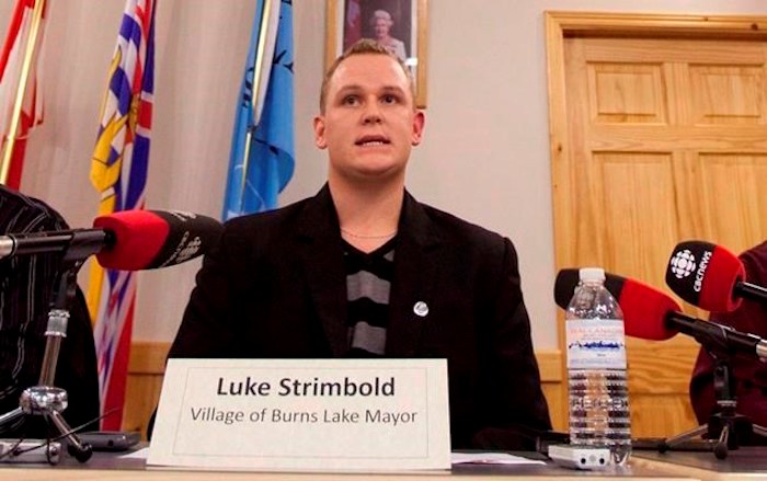  British Columbia's prosecution service says the former mayor of Burns Lake has been sentenced to two years less a day for sexual offences involving four boys under the age of 16. Luke Strimbold, Mayor of the Village of Burns Lake addresses the media during a news conference in Burns Lake, B.C. Saturday, Jan. 21, 2012. THE CANADIAN PRESS/Jonathan Hayward