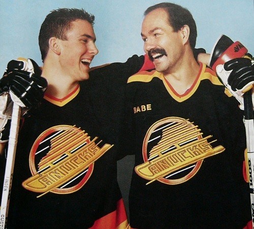 Harold Snepsts enjoys a laugh with Trevor Linden