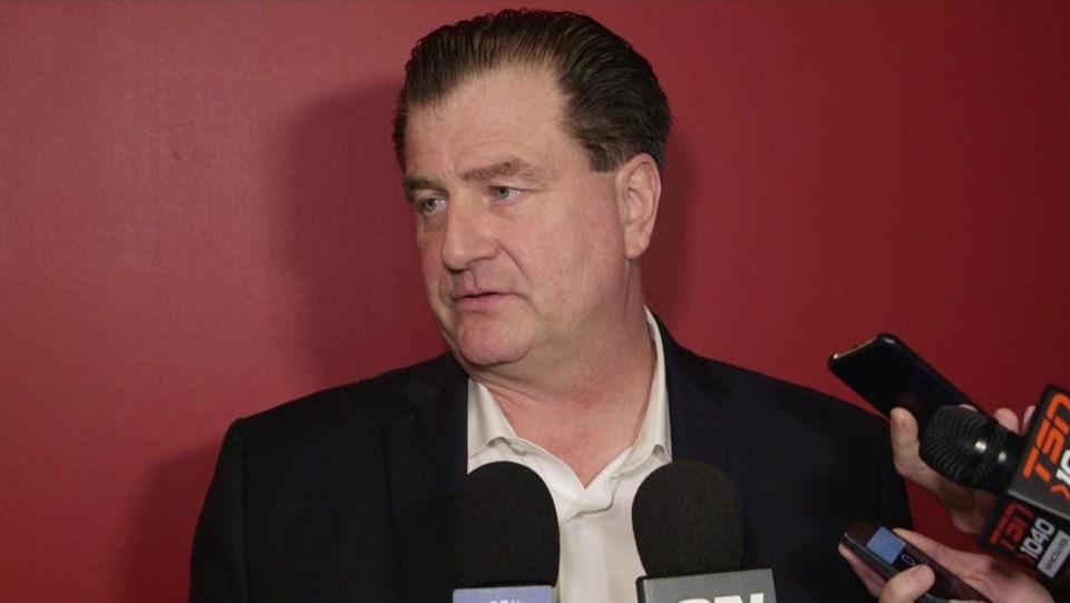 Jim Benning dressing casually