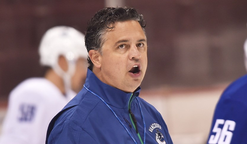 Travis Green speaking at Canucks practice.