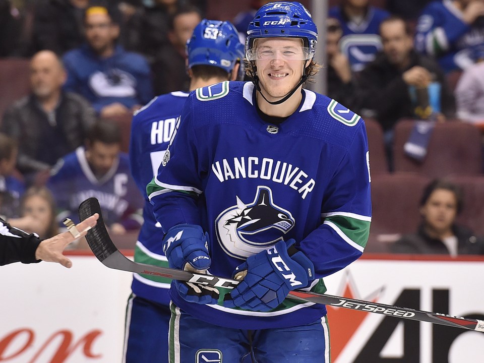 Brock Boeser of the Vancouver Canucks smiles while facing the Carolina Hurricanes