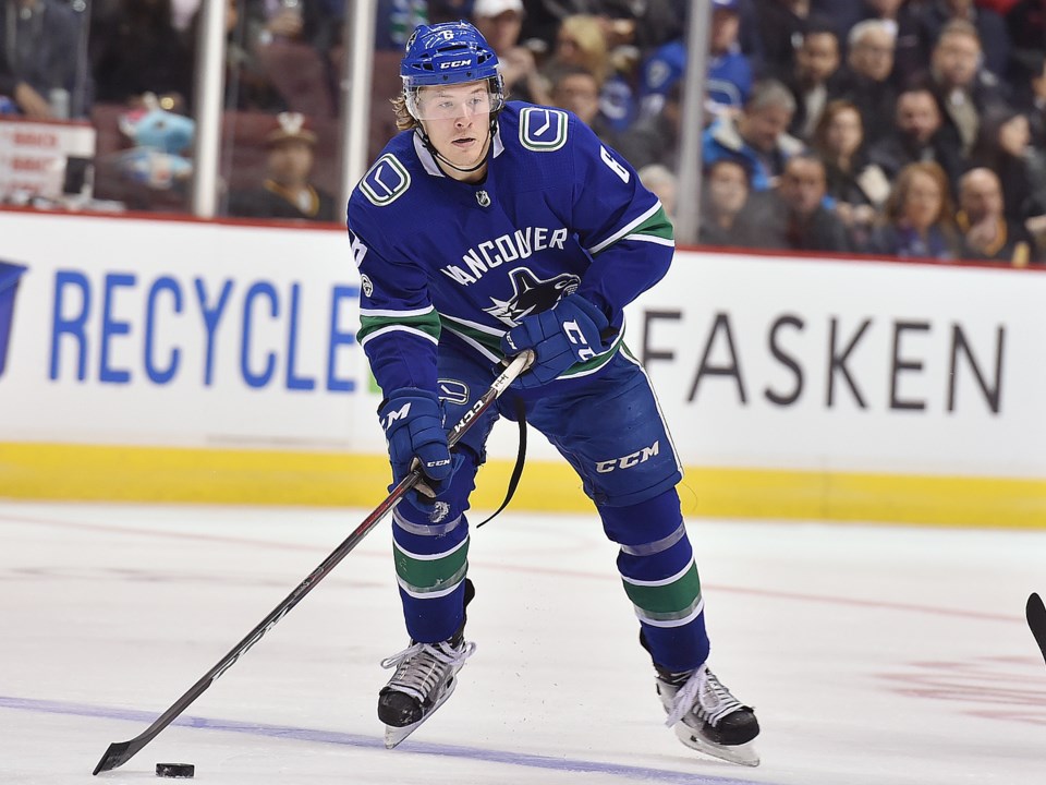 Brock Boeser skates with the puck for the Vancouver Canucks.