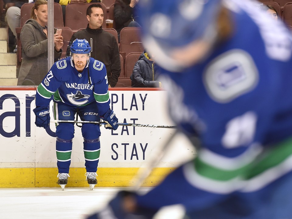 Daniel Sedin waits for the puck during warm-up.