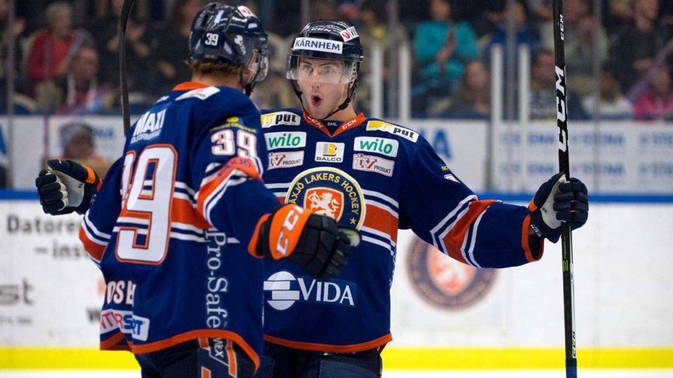 Philip Holm celebrates a goal for the Vaxjo Lakers