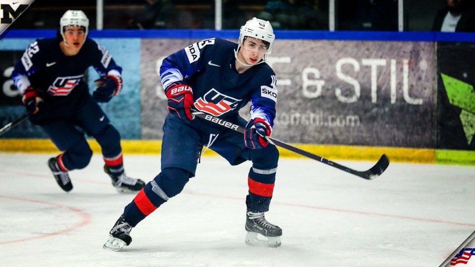 Quinn Hughes skating with Team USA at the 2018 World Hockey Championships.