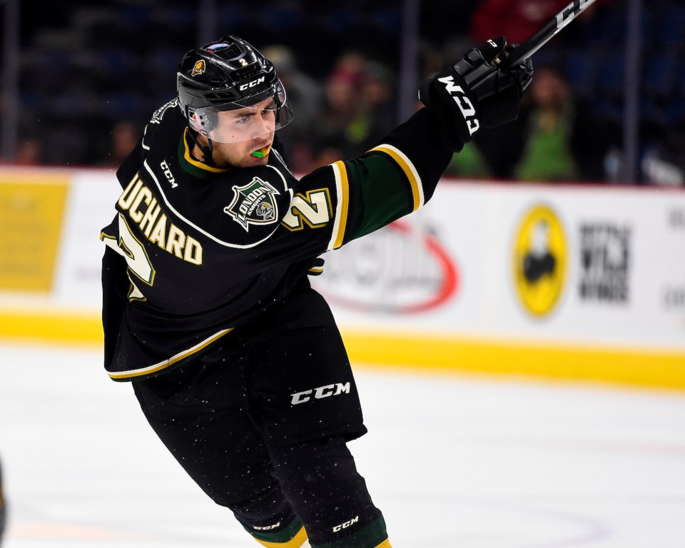 Evan Bouchard of the London Knights takes a slap shot.