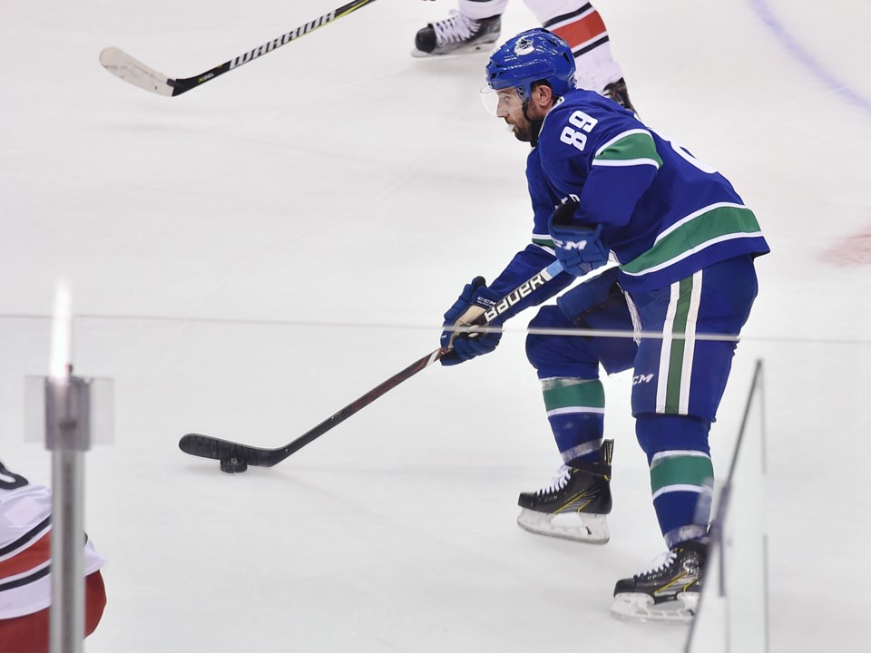 Sam Gagner skates up ice for the Canucks.