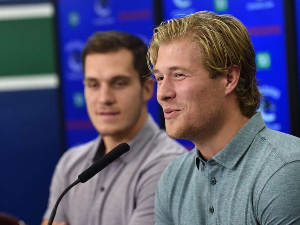 Brock Boeser laughs at a question during the Canucks media day before the 2018-19 season.