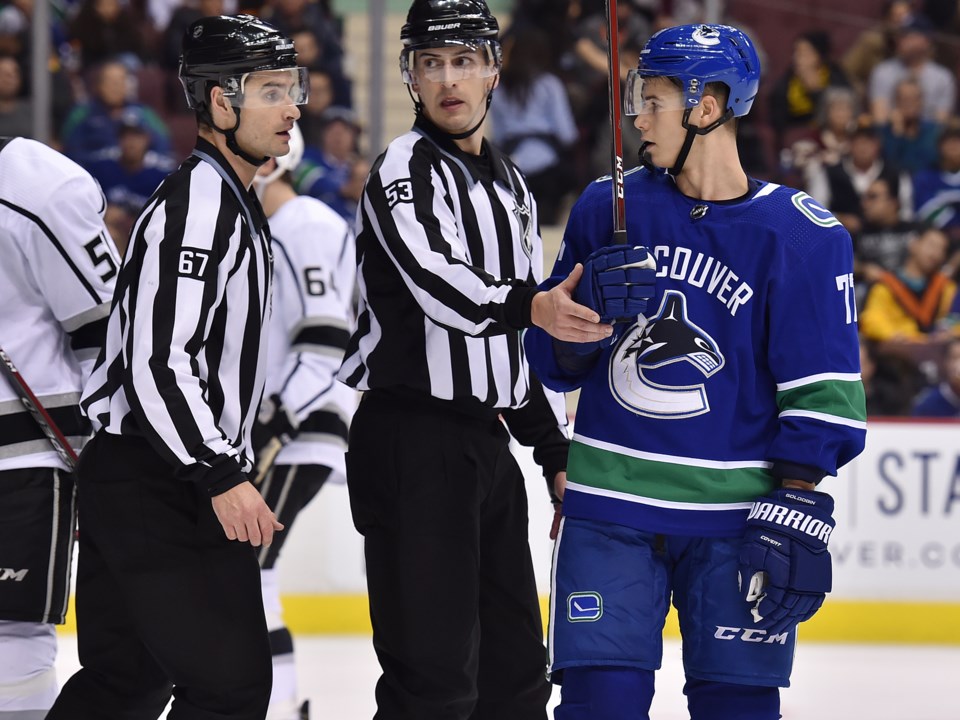 Nikolay Goldobin talks with the linesmen during a game with the Vancouver Canucks