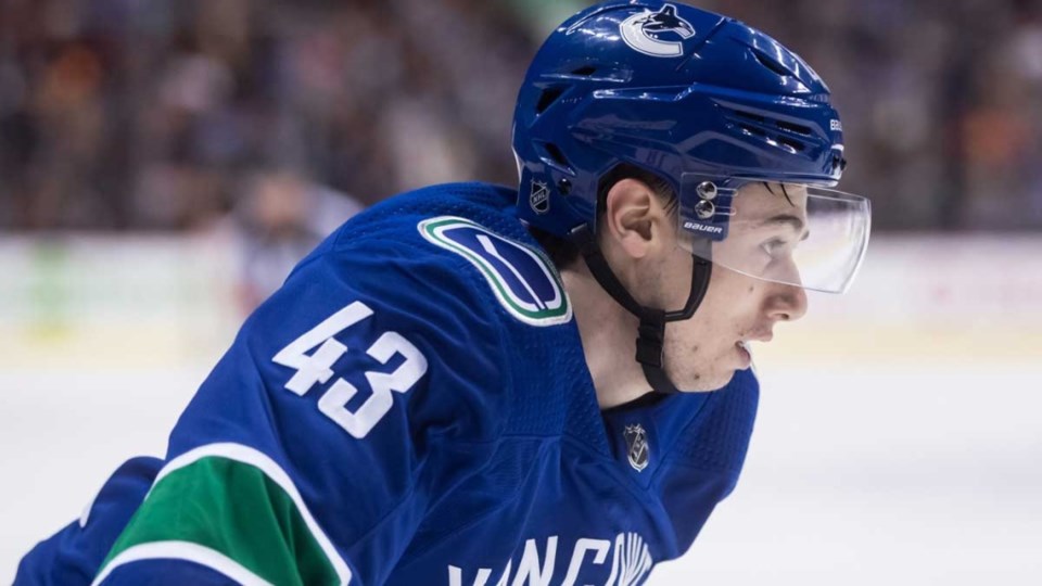 Quinn Hughes skates for the Vancouver Canucks.