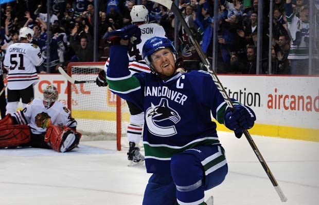 Henrik Sedin celebrates a goal