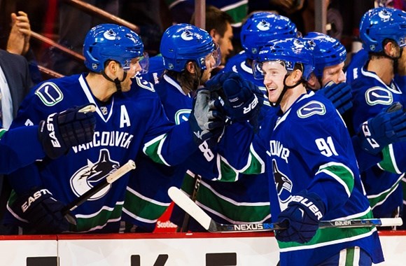 Jared McCann scores a goal, gets high fives, is happy