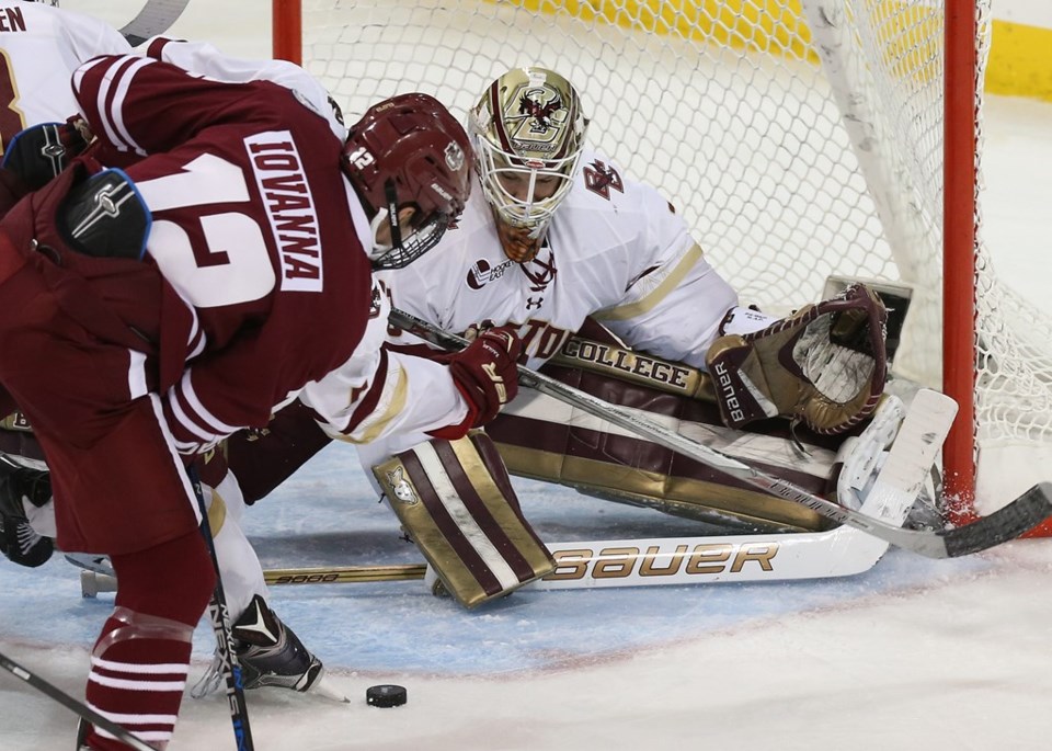 Thatcher Demko stretches to make the save