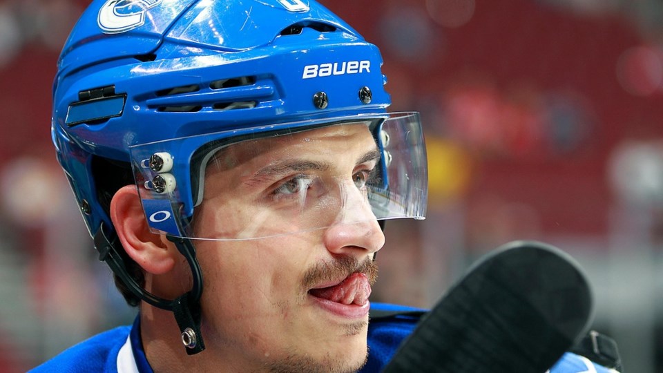 Luca Sbisa licks his moustache