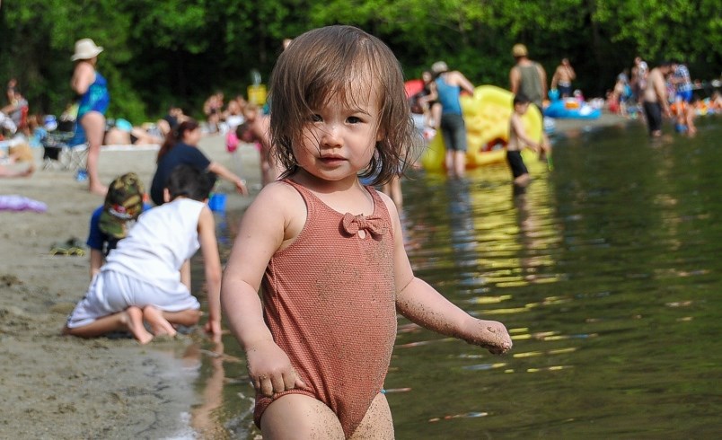 eloise-chan-plays-in-the-sand-with-her-father-chris-at-belcarra-regional-park-s-white-pine-beach