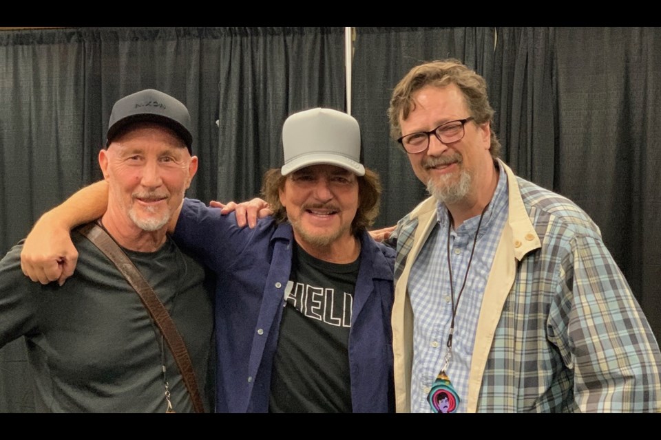 Harpo's Cabaret booking agents Gary Van Buskirk, left, and Marcus Pollard, right, with Peal Jam frontman Eddie Vedder following the band's performance in Vancouver on Monday. COURTESY MARCUS POLLARD