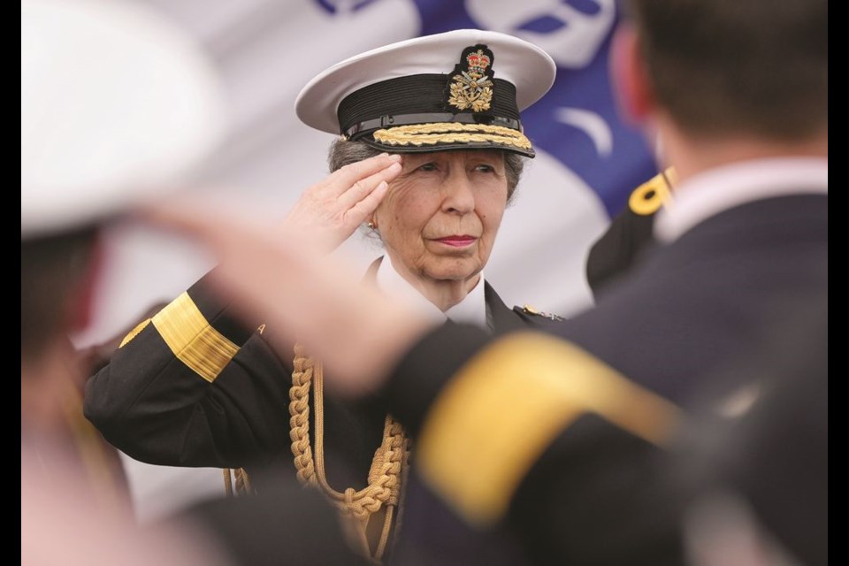 Princess Anne salutes during the playing of O Canada at the conclusion of a commissioning ceremony aboard HMCS Max Bernays as part of Fleet Week, in North Vancouver, B.C., on Friday, May 3, 2024. HMCS Max Bernays is the first Arctic and Offshore Patrol Vessel to join the Royal Canadian Navy's Pacific fleet. THE CANADIAN PRESS/Darryl Dyck
