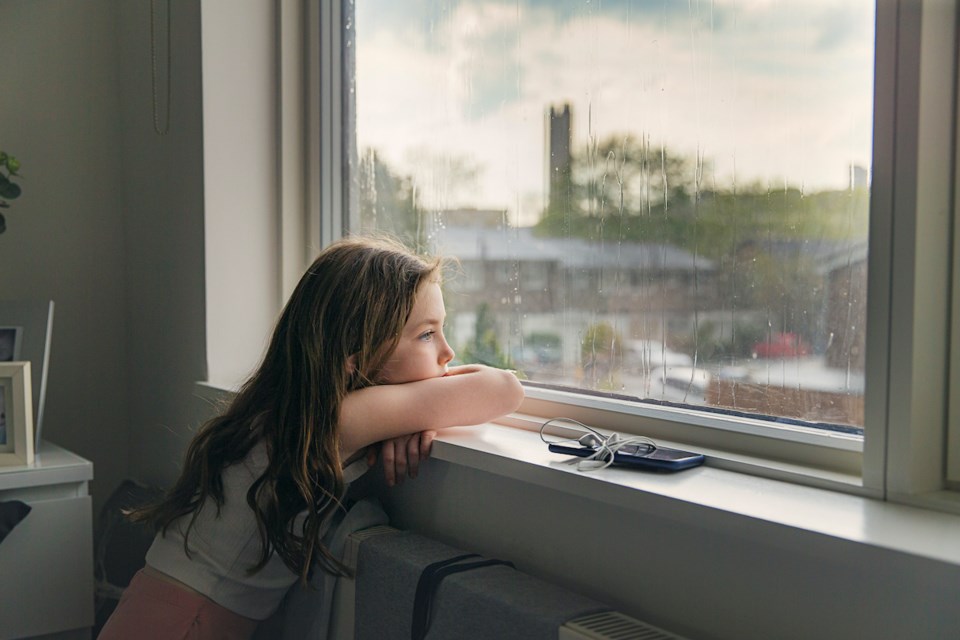 girl looking out window