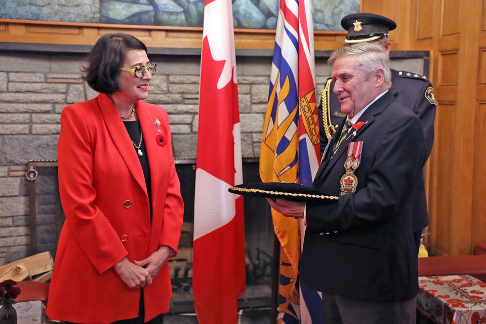 Angus Stanfield, chairman of the Victoria Poppy Fund, presents Lt.-Gov. Janet Austin with the first poppy of the Royal Canadian Legion's 2021 Poppy Campaign at Government House on Tuesday, Oct. 26, 2021. Funds raised in the annual campaign support veterans, their families and dependants, seniors, education and Remembrance programs. GOVERNMENT HOUSE